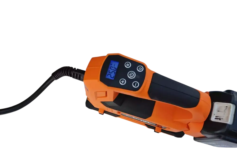 Robota dc-co18v akkukäyttöinen ilmapumppu oranssi ja musta digitaalisella näytöllä ja letkulla auton renkaaseen liitettynä