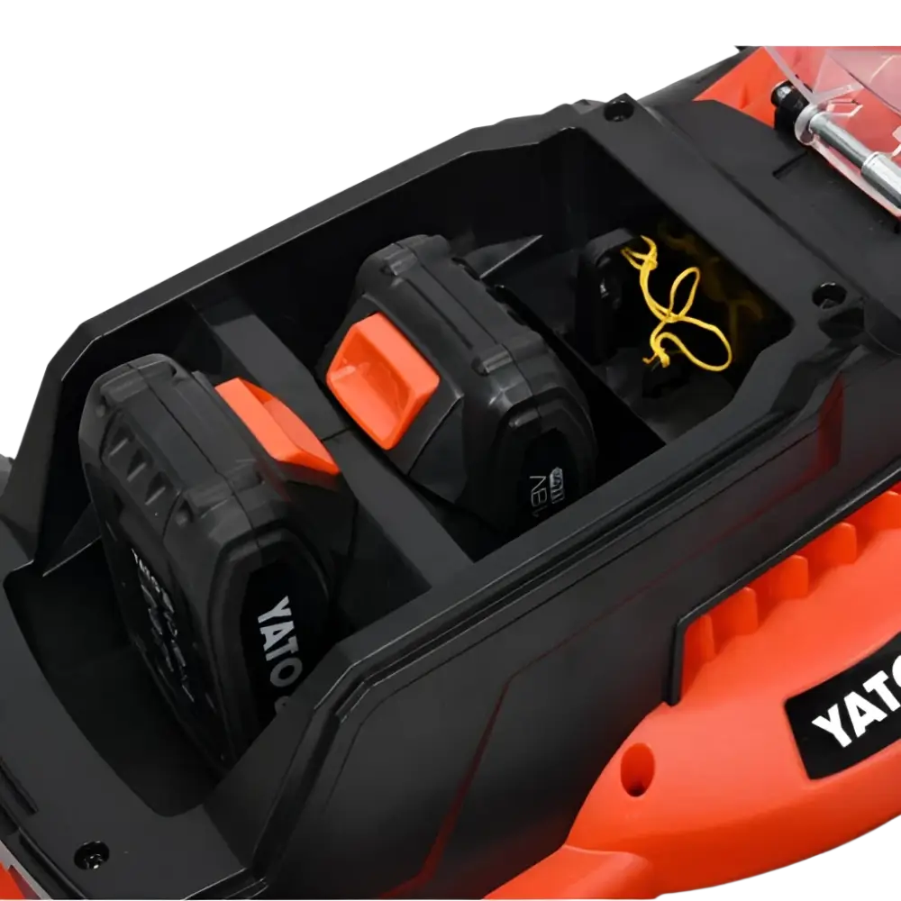 Oranssi ja musta yato akkuruohonleikkuri 2 x 18v 34 cm kahdella akkulla keskikokoisille pihoille yhdellä latauksella